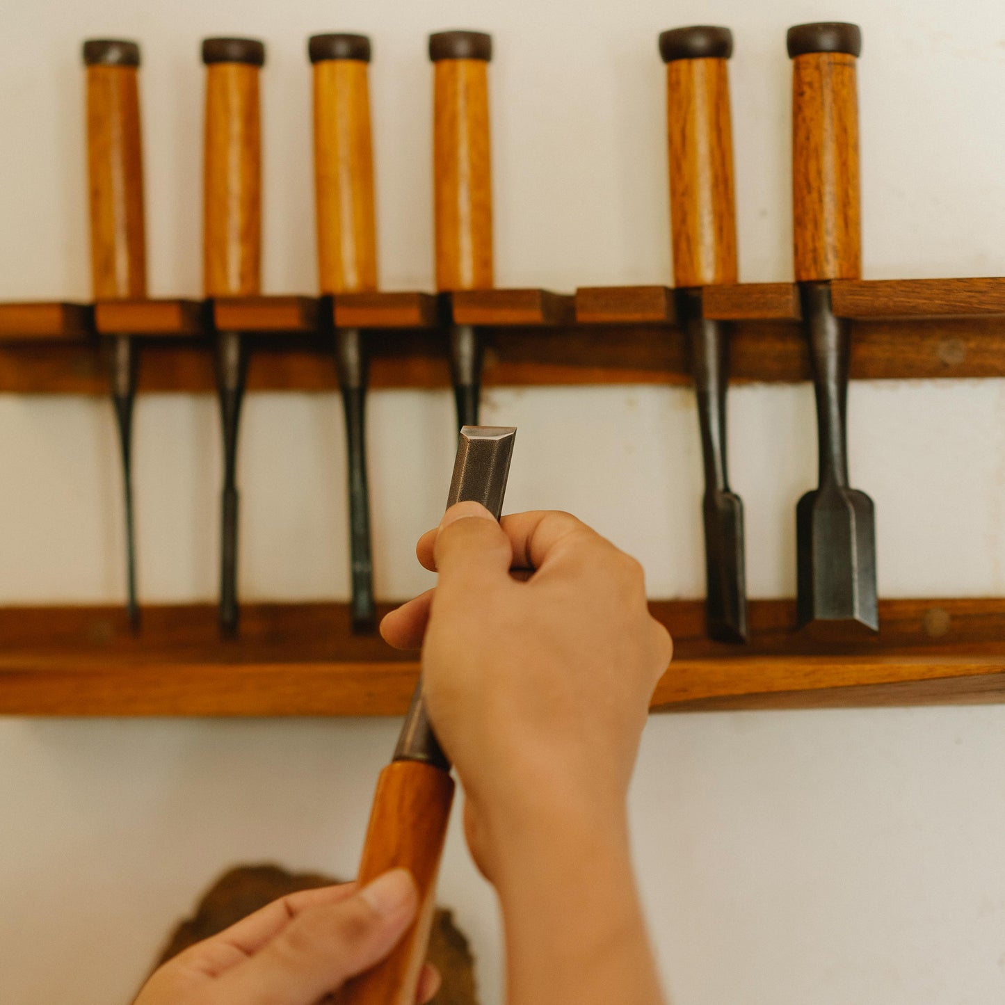 Person chooses woodworking tools