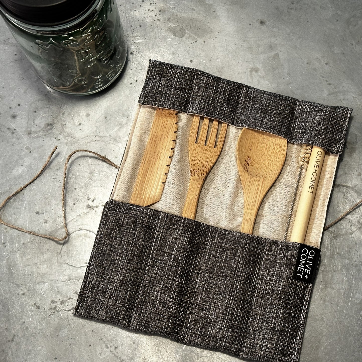Photo of a Sarita Bamboo flatware set with jute and cotton case