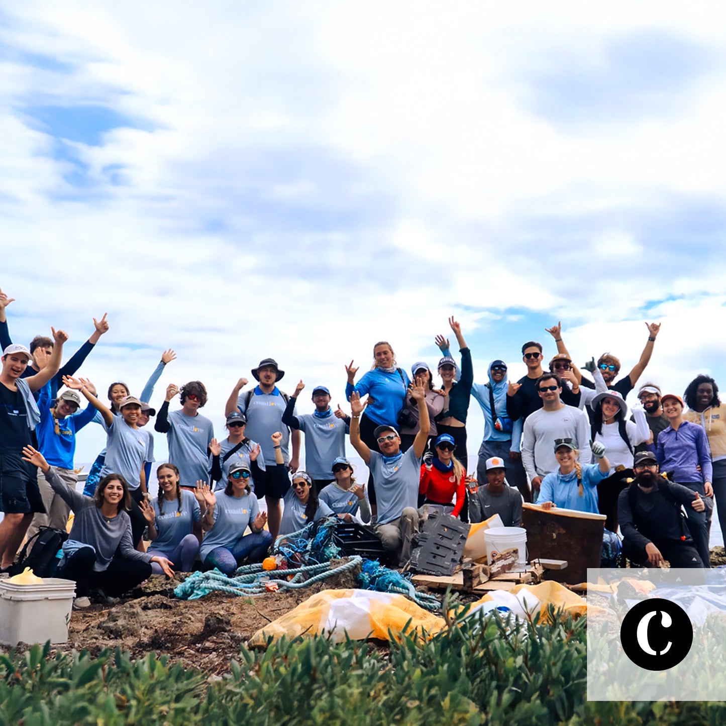 A volunteer Coastlove cleanup crew photographed on the beach