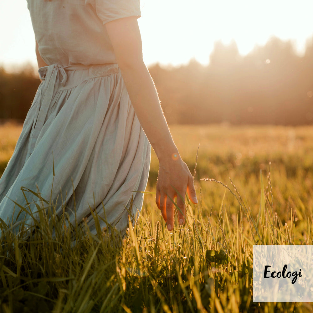 Photo of a woman walking through a field